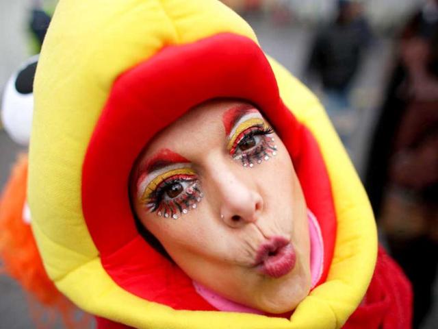 A fool celebrates the beginning of the street carnival in Cologne, western Germany as the hot carnival season was launched. Hundreds of thousands of Germans, mainly in the western Rhine region, crowd the streets to celebrate Women's Carnival Day. AFP Photo