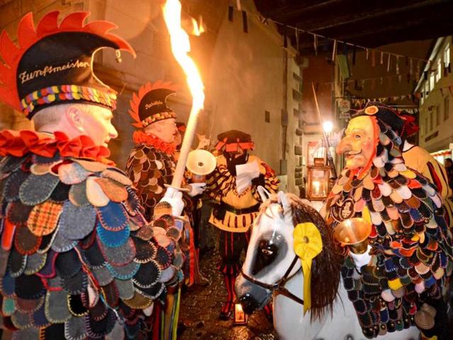 A group of the Constance fool's guild "Blätzlebueben" with lanterns and torches is pictured in Constance, southern Germany. AFP Photo