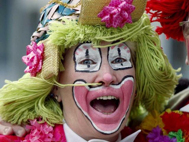 A woman dressed as clown celebrates "Weiberfastnacht" (Women's Carnival) in Cologne. Reuters