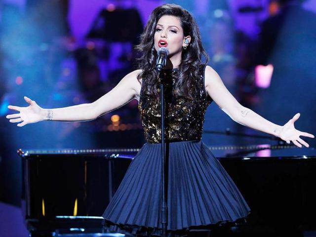 Israeli-born French singer Tal Benyerzi, known as Tal performs on stage during the 28th Victoires de la Musique annual ceremony, France's top music awards, at the Zenith concert hall in Paris, France. AP