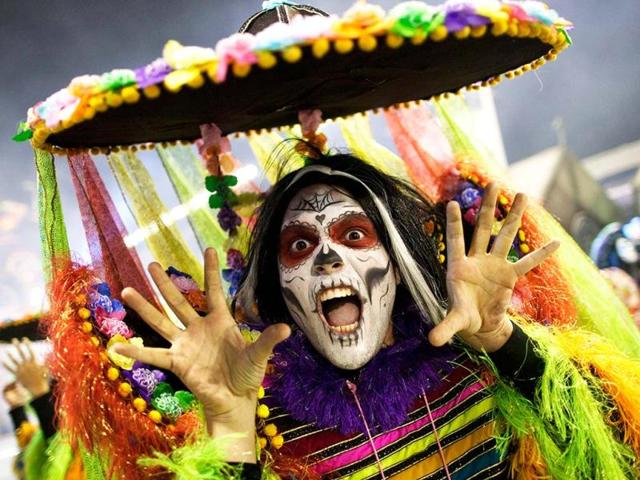 A dancer from the Rosas de Ouro samba school performs during a carnival parade in Sao Paulo, Brazil. AP