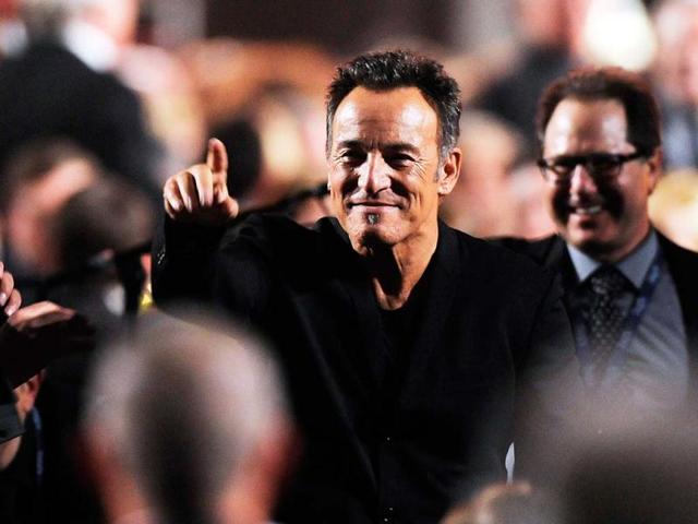 Honoree Bruce Springsteen gestures to attendees at the MusiCares Person of the Year tribute at the Los Angeles Convention Center in Los Angeles. AP