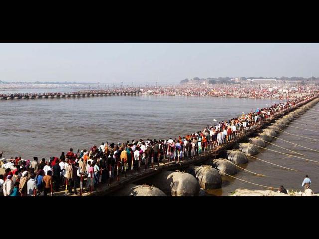 Thousands of devotees walk across a pontoon bridge at Sangam, before bathing at the confluence of the Rivers Ganges, Yamuna and Saraswati, during Maha Kumbh festival, in Allahabad. AP