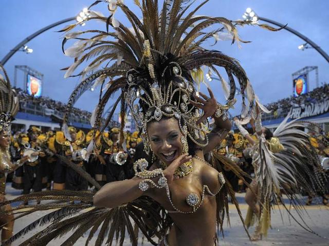 The main Carnival days in Sao Paulo are Friday and Saturday, when the area’s top samba schools compete for bragging rights to being the best dancers in the city. The Sambadrome attracts 30,000 roaring spectators, while the streets open up into open-air parties. Photo: AFP/Mauricio Lima
