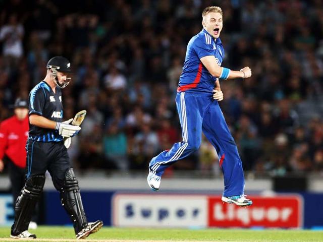 England's Luke Wright celebrates the wicket of New Zealand's Martin Guptill (not pictured) as New Zealand's Colin Munro looks on during the International Twenty20 cricket match between New Zealand and England played at Eden Park in Auckland. AFP/Michael Bradley