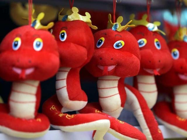 Snake toys are displayed for sale at a temple fair to celebrate the Chinese Lunar New Year at Ditan Park (the Temple of Earth), in Beijing. (Reuters)