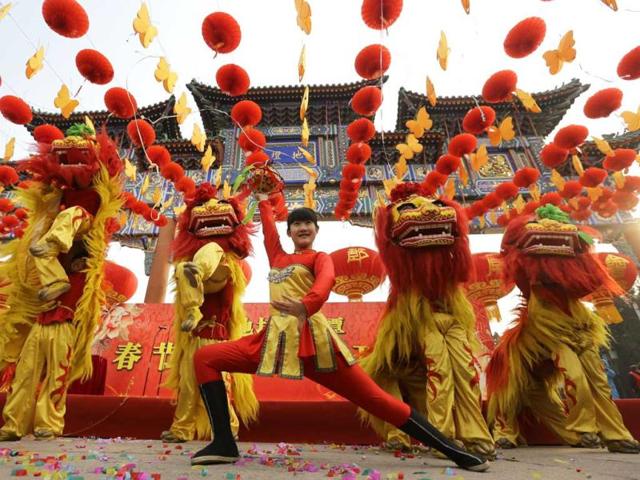 Chinese artists perform the lion dance during the opening ceremony of the Spring Festival Temple Fair at Ditan Park (the Temple of Earth), in Beijing. (Reuters)
