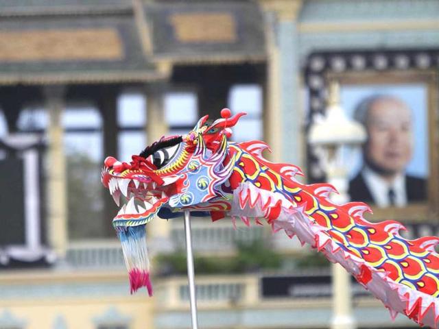 The head of the dragon dance costume is seen as Chinese Cambodian men perform in celebration of the upcoming Chinese Lunar New Year in front of the Royal Palace, Phnom Penh. (Reuters)