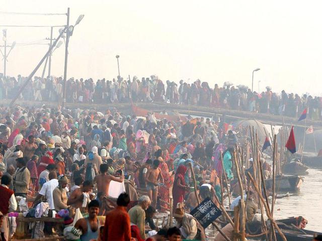 Hindu devotees walk across a pontoon bridge for a holy dip at Sangam, the confluence of the Ganges, the Yamuna and the Saraswati rivers during the Maha Kumbh festival in Allahabad. AP Photo