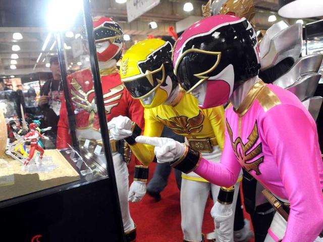 The Power Rangers check out their 20th anniversary collectibles at the American International Toy Fair in New York. AP/Diane Bondareff/Invision for Saban Brands
