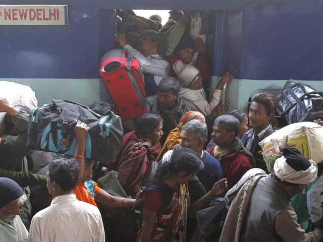 Pilgrims crowd to board a train at an overcrowded railway station in Allahabad, the site of the fatal stampede. (Reuters)