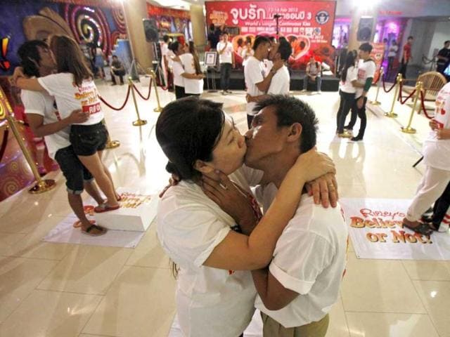 Participants-Ekkachai-Tiranarat-centre-R-44-kisses-Laksana-Tiranarat-33-during-an-attempt-to-break-the-world-record-for-the-longest-kiss-in-Pattaya-150-km-90-miles-east-of-Bangkok-Reuters