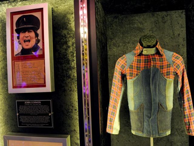 A jacket worn by John Lennon and his lyrics to the song "Help" are displayed at the launch of Hard Rock International's traveling music memorabilia collection, "Gone Too Soon," at Hard Rock Cafe New York. (AP Photo)
