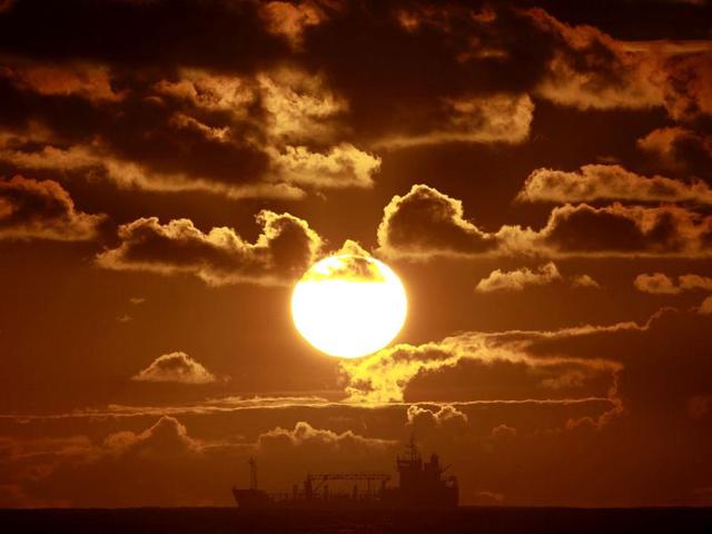 A ship crosses Coogee beach bay in Sydney at sunrise February 14, 2013. (Reuters)