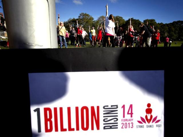 A group of women and men dance as they participate in an event labelled 'One Billion Rising' at a park in central Sydney, Australia. (Reuters)