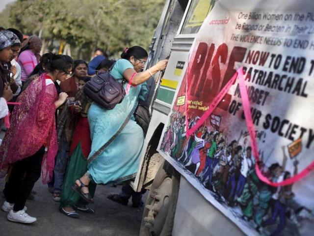 Activists board a bus traveling across the city to spread awareness and support 'One Billion Rising' global campaign in New Delhi. AP Photo
