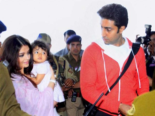 I only have eyes for daddy: Aaradhya watches as daddy Abhishek makes way for her and mommy.