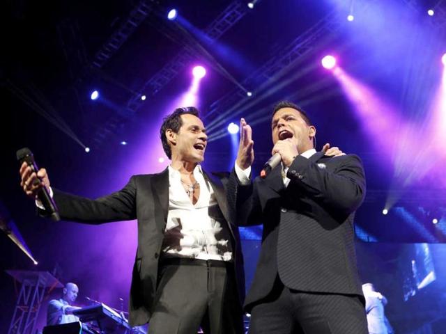 Singer Marc Anthony, left, performs guest artist Tito "El Bambino" during a concert at the Barclays Center in New York. (AP Photo)