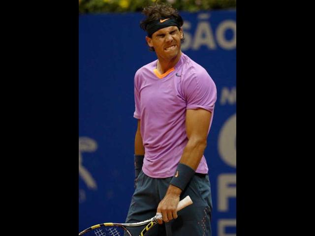 Spanish tennis player Rafael Nadal gestures after losing a point against Argentine Carlos Berlocq during the Brazil Open at Ibirapuera gymnasium in Sao Paulo, Brazil. (AFP Photo)