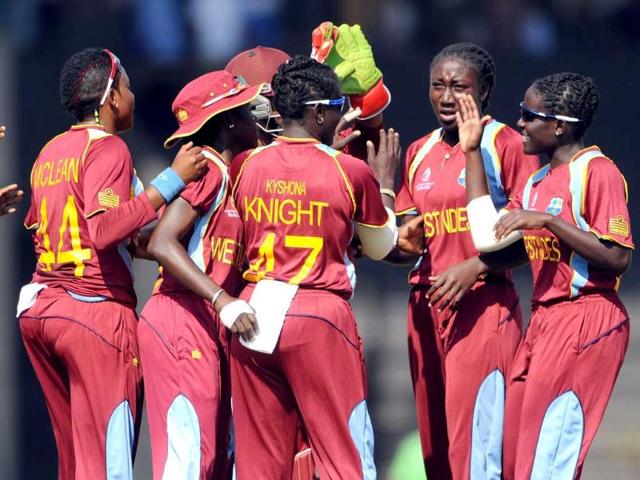 West Indian cricketers celebrate the wicket of Australian cricketer Meg Lanning during the final match of the ICC Women's World Cup 2013 between Australia and West Indies at Brabourne stadium in Mumbai. AFP Photo