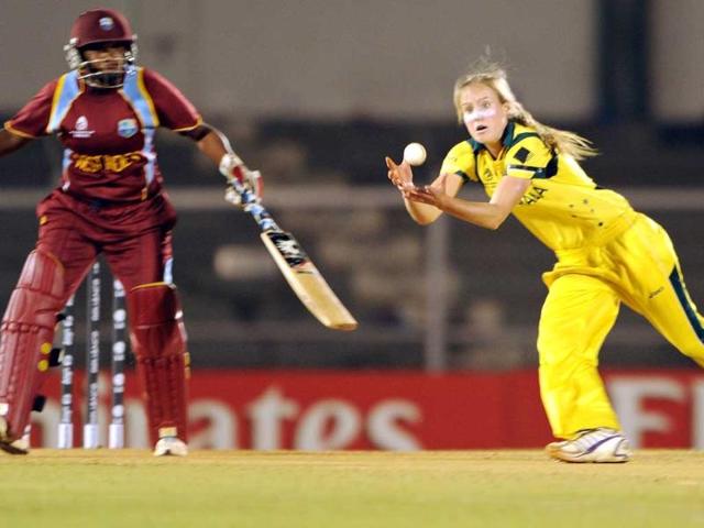 Australian cricketer Elysse Perry takes a return catch of unseen West Indies cricketer Stafanie Taylor as non-striker Natasha McLean (L) looks on during the final match of the ICC Women's World Cup 2013 between Australia and West Indies at the Cricket Club of India's Brabourne stadium in Mumbai. AFP Photo