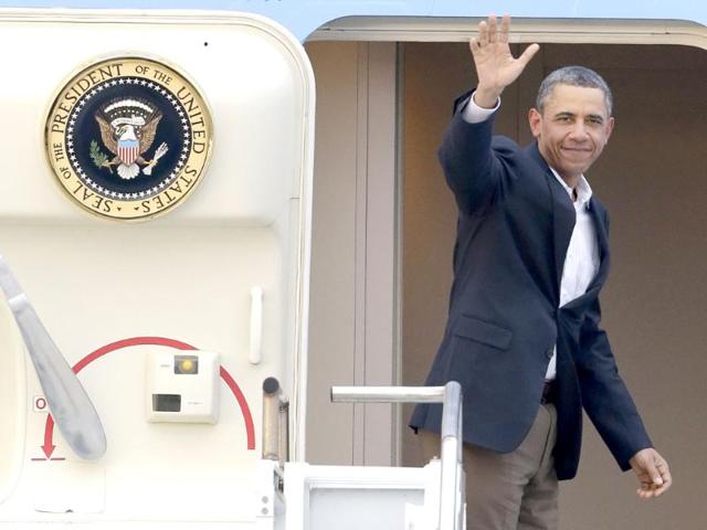 President-Barack-Obama-waves-in-the-doorway-of-Air-Force-One-as-he-departs-from-Palm-Beach-International-Airport-in-West-Palm-Beach-Fla-Obama-spent-the-long-Presidents-Day-weekend-playing-golf-AP-Wilfredo-Lee