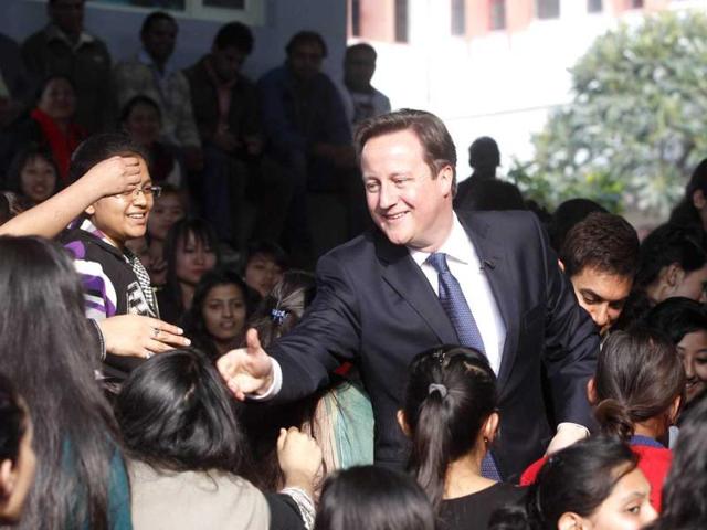 British-PM-David-Cameron-C-L-and-Bollywood-actor-Aamir-Khan-C-R-pose-with-Indian-women-cab-drivers-from-Sakha-cab-services-in-New-Delhi-on-February-19-AFP-PHOTO