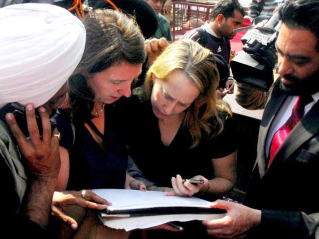 Journalists copy the comments of British Prime Minister David Cameron on Jallianwala Bagh massacre carried out by British General Dyre in 1919 killing hundreds of Indians, in Amritsar. PTI photo