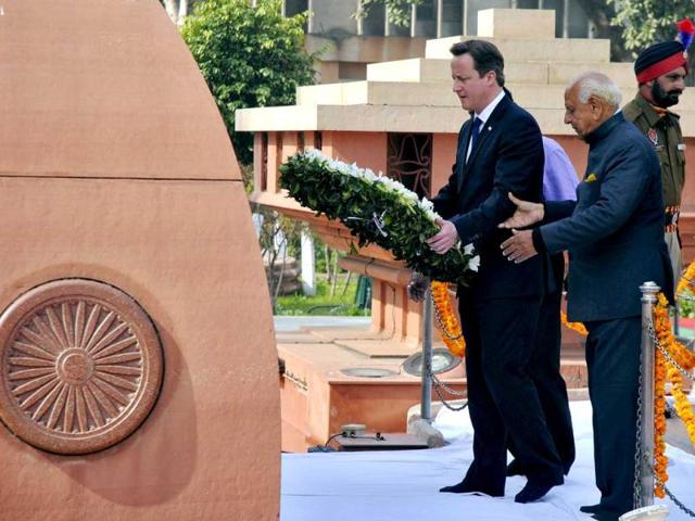 Britain's Prime Minister David Cameron places a wreath at the Jallianwala Bagh memorial in Amritsar. Cameron became the first serving British prime minister to voice regret about one of the bloodiest episodes in colonial India, a massacre of unarmed civilians in the city of Amritsar in 1919. Reuters photo