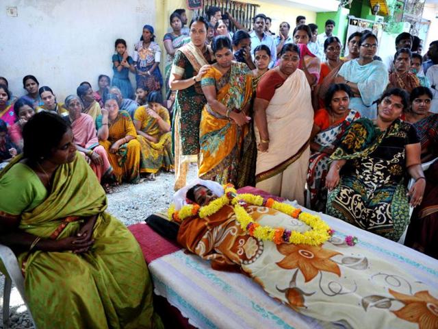 Relatives gather around Swapna Reddy's body who died in the Hyderabad blasts. (AFP Photo)