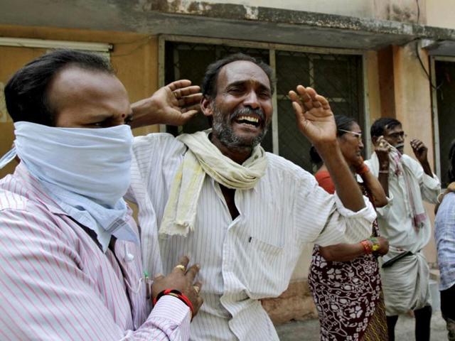 A man mourns the death of a relative, outside a hospital mortuary, who was killed by one of the explosions in Hyderabad. (Retuers)