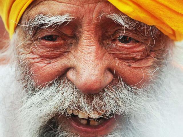 Indian-born British national Fauja Singh, 101 speaks to the media after crossing the finish line in the 10-km event as part of the Hong Kong Marathon. Singh retired from competitive races after the marathon. AFP photo