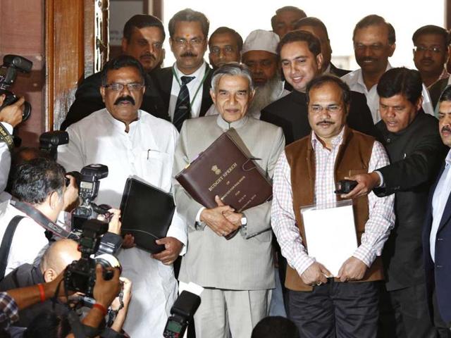 Union-railway-minister-Pawan-Kumar-Bansal-C-carries-his-budget-speech-as-he-walks-towards-Parliament-to-present-the-union-railway-budget-2013-14-in-New-Delhi-AFP Union-railway-minister-Pawan-Kumar-Bansal-C-carries-his-budget-speech-as-he-walks-towards-Parliament-to-present-the-union-railway-budget-2013-14-in-New-Delhi-AFP