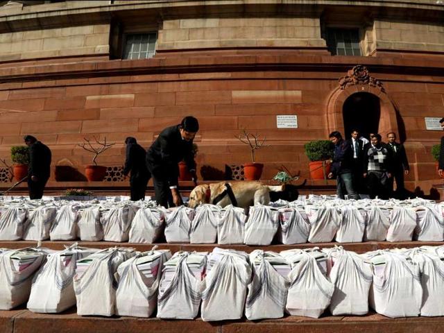 Papers related to the railway budget are inspected before being taken inside the Parliament for the the annual railway budget in New Delhi. AP Photo