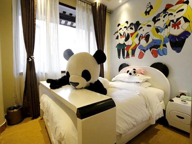 A panda toy on a bed in a room of a panda-themed hotel at the foot of Emei Mountain in Emeishan, southwest China's Sichuan province. The hotel is reportedly the first panda-themed hotel in the world. AFP