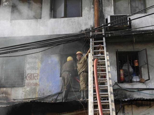Firemen try to douse fire that broke out early morning at an illegal six-story plastics market in Kolkata. AP photo