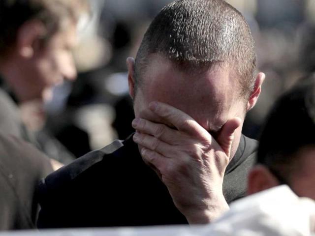A faithful cries during Pope Benedict XVI's general audience in St Peter's Square at the Vatican. Tens of thousands of people toting banners saying "Grazie!" - "Thank you" - jammed the piazza in Rome to bid Benedict farewell. AP/Gregorio Borgia