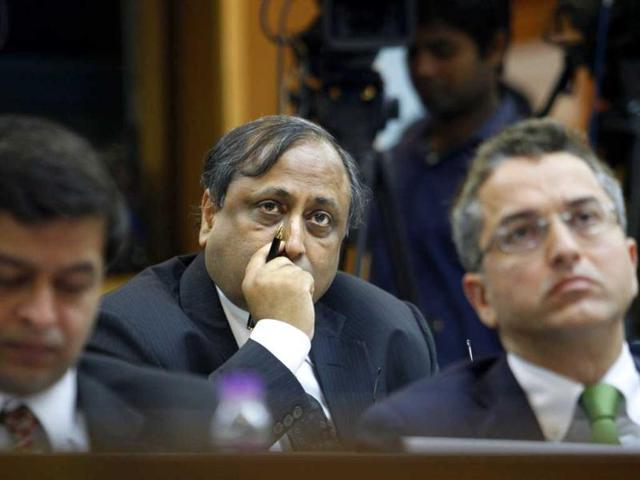Businessmen watch the live telecast of finance minister P Chidambaram presenting the union budget in New Delhi. AP photo