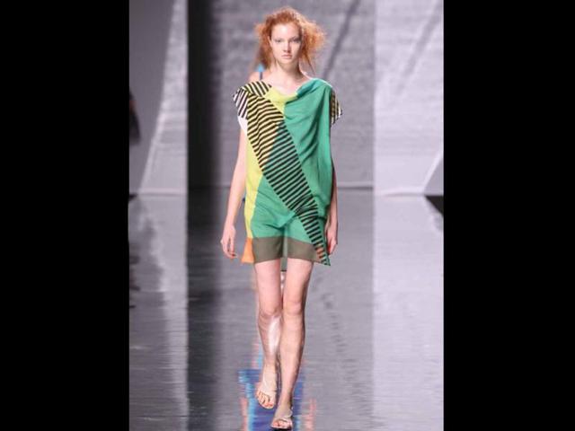 A-model-walks-the-ramp-in-a-dress-designed-by-Issey-Miyake A-model-walks-the-ramp-in-a-dress-designed-by-Issey-Miyake