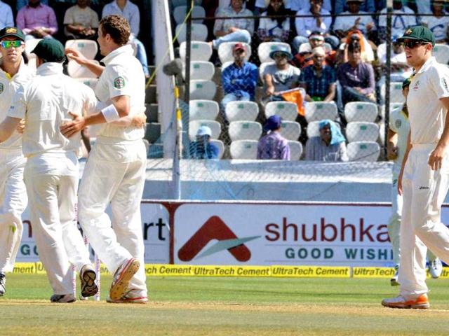 Australian players celebrate the dismissal of Virender Sehwag during the second day of their second test match in Hyderabad. PTI photo