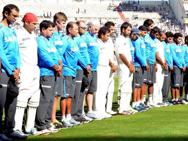 Players pay tribute to the victims of the recent twin blasts before the start of the 2nd day of the 2nd Test match between Indian and Australia in Hyderabad. PTI photo