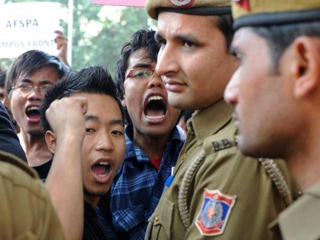 Supporters of human anti-AFSPA activist Irom Sharmila demonstrate outside the Patiala court, where Sharmila made an appearance, in New Delhi. Sharmila has been on hunger-strike for 12 years to protest AFSPA appeared in Patiala court on charges of attempting to commit suicide. AFP PHOTO