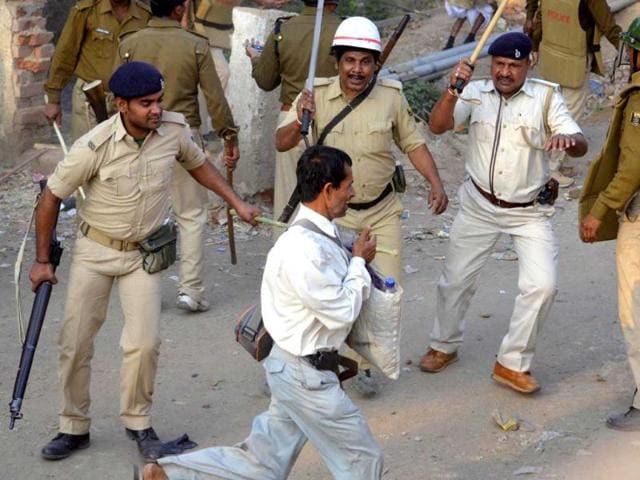 Policemen lathicharge Bihar state teachers after clashes during protests demanding pending and increase in salary under the banner of Bihar Panchayat Nagar Prarambhik Shikshak Sangh in Patna. Agencies