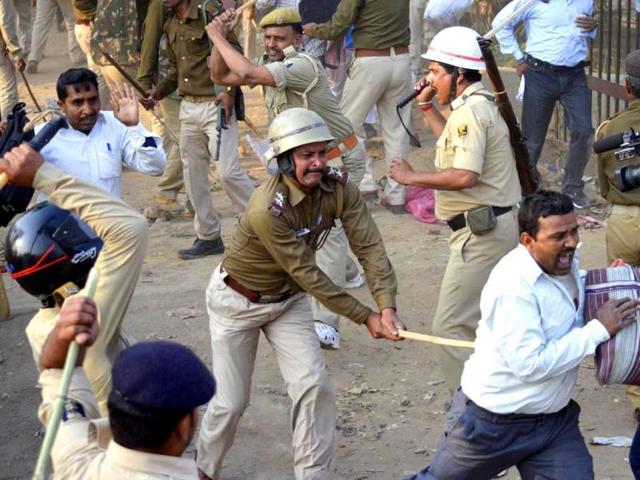 Police wield their batons against teachers during a protest in Patna. Dozens of teachers, who work on contract, held a protest demanding the regularisation of their jobs and increase in their wages, the protesting teachers said. REUTERS