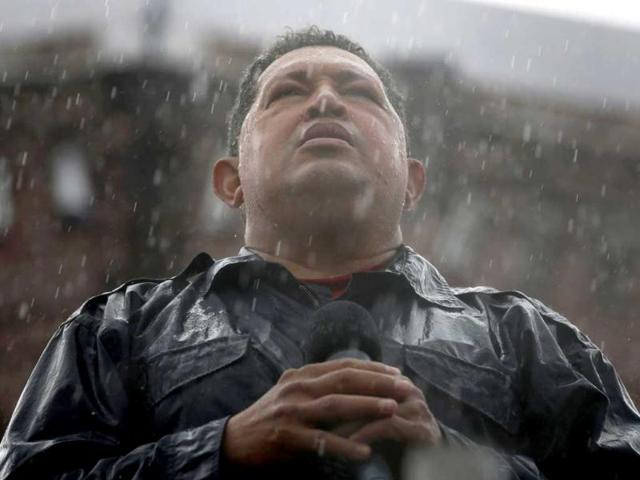 Venezuela's President and presidential candidate Hugo Chavez speaks in the rain during his closing campaign rally in Caracas in this October 4, 2012 file photo. Chavez died on March 5, 2013, after a two-year battle with cancer. (Reuters)
