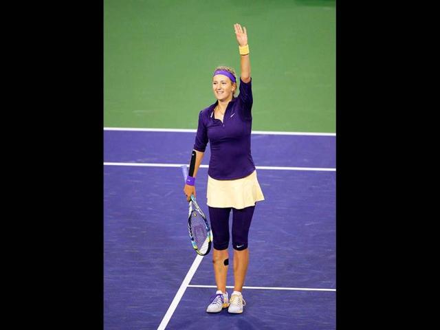 Victoria Azarenka waves to fans after defeating Daniela Hantuchova, of Slovakia, at the BNP Paribas Open tennis tournament in Indian Wells. (AP)