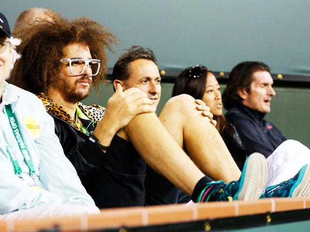 Singer and boyfriend of Victoria Azarenka of Belarus, Redfoo, watches Azarenka play against Daniela Hantuchova of Slovakia in Indian Wells. (Reuters)