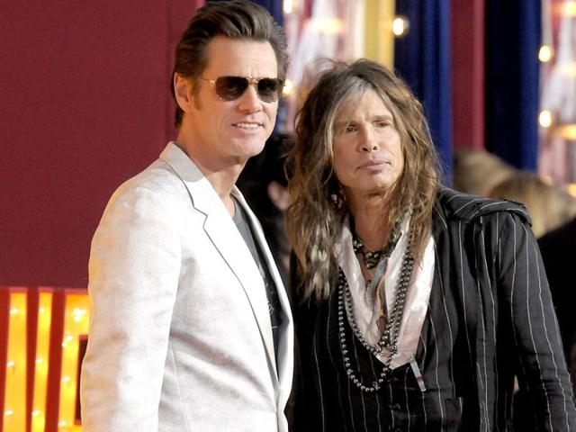 Actor Jim Carrey, left, and singer Steven Tyler arrive at the world premiere of the feature film The Incredible Burt Wonderstone at the TCL Chinese Theatre in Los Angeles. AP photo