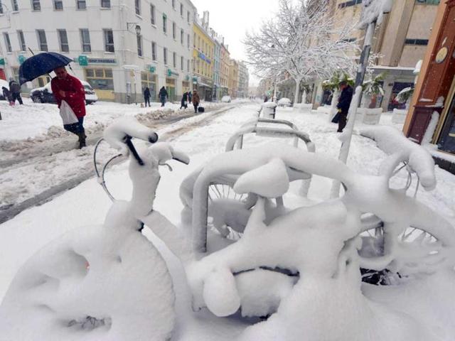 Snow covers bicycles following heavy snowfalls in Cherbourg. (AFP)