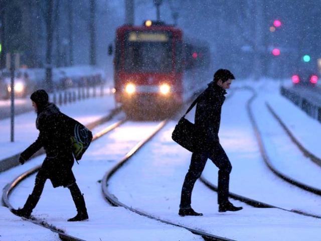 Pedestrians walk through the snow in Cologne, western Germany. (AFP)